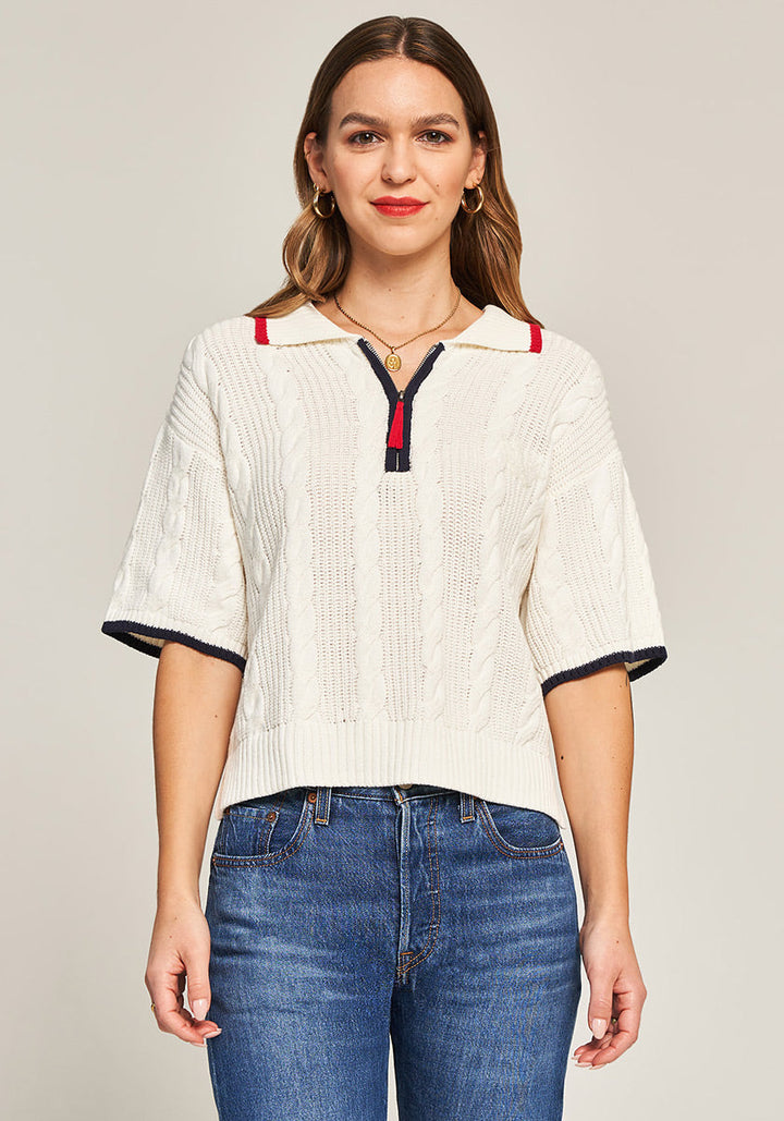 Pull en maille torsadée avec col polo zippé