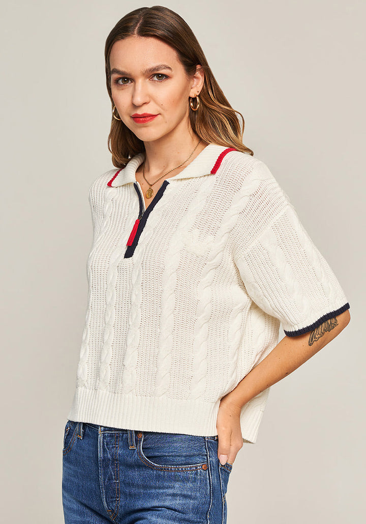 Pull en maille torsadée avec col polo zippé