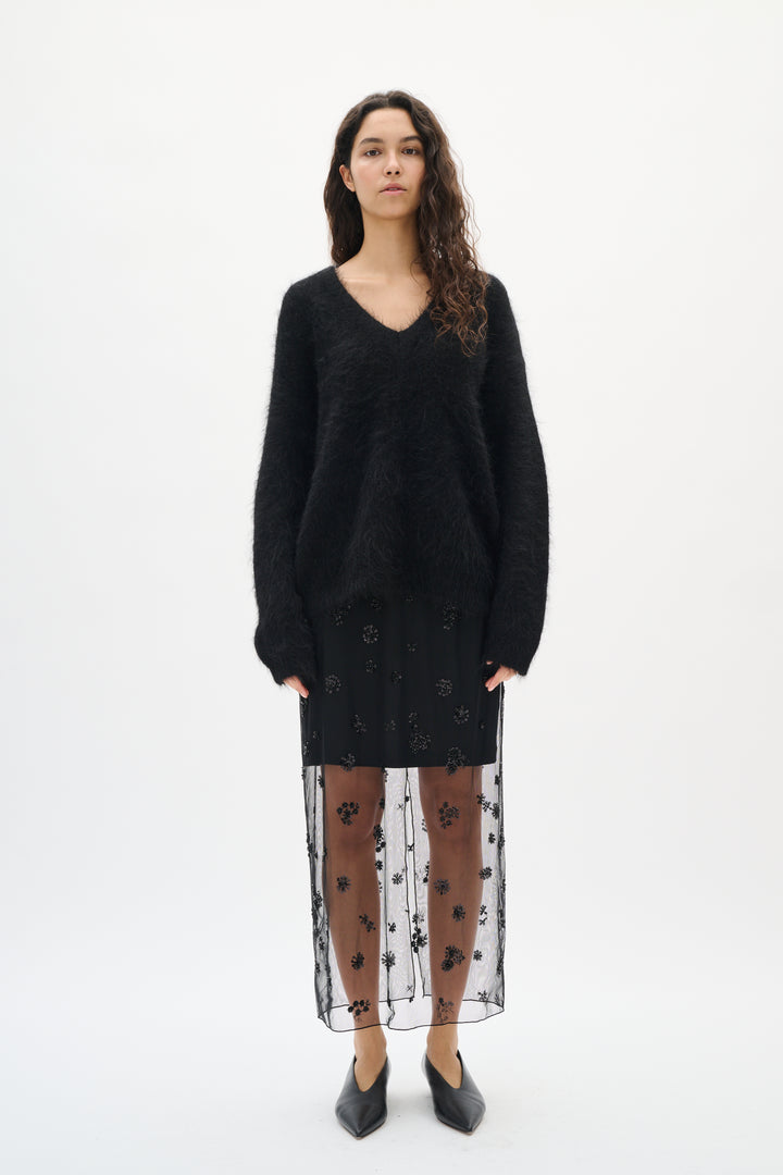 Jupe midi transparente ornée de perles Kui