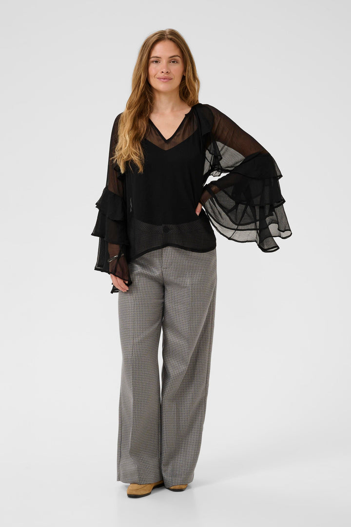 Blouse transparente à volants Lianoa