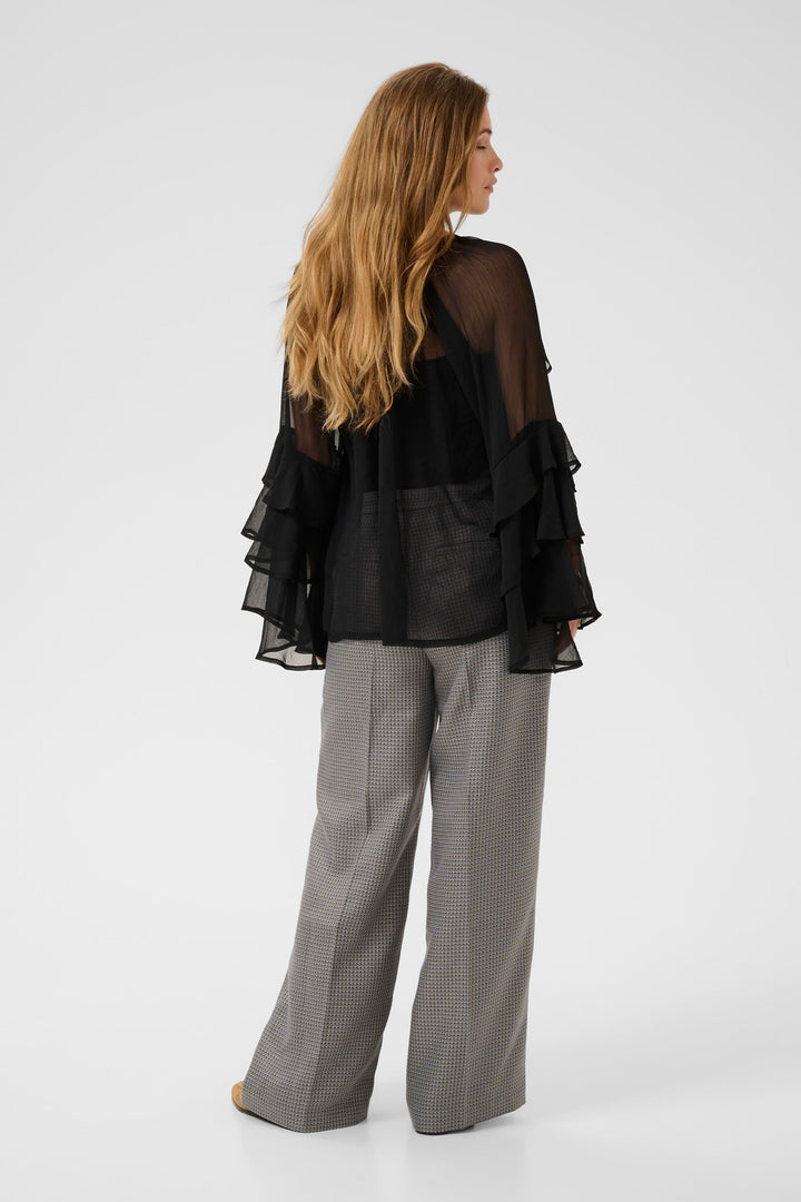 Blouse transparente à volants Lianoa