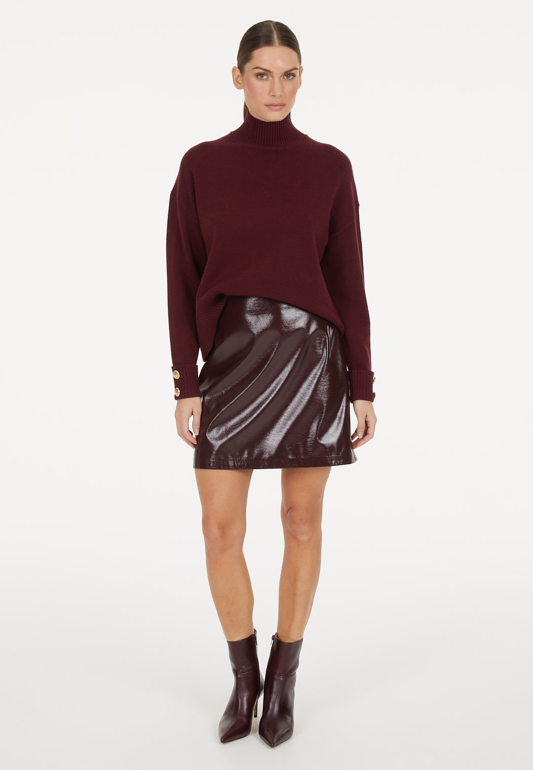Pull avec boutons aux poignets et col montant