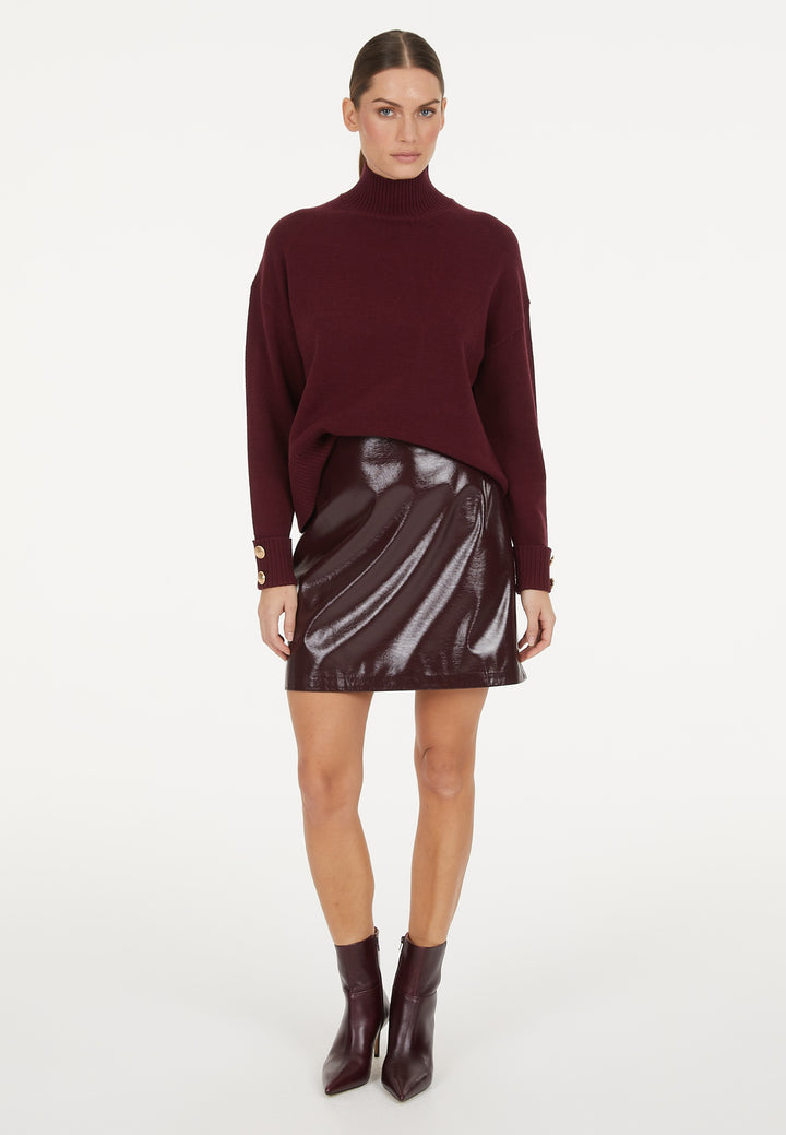 Pull avec boutons aux poignets et col montant