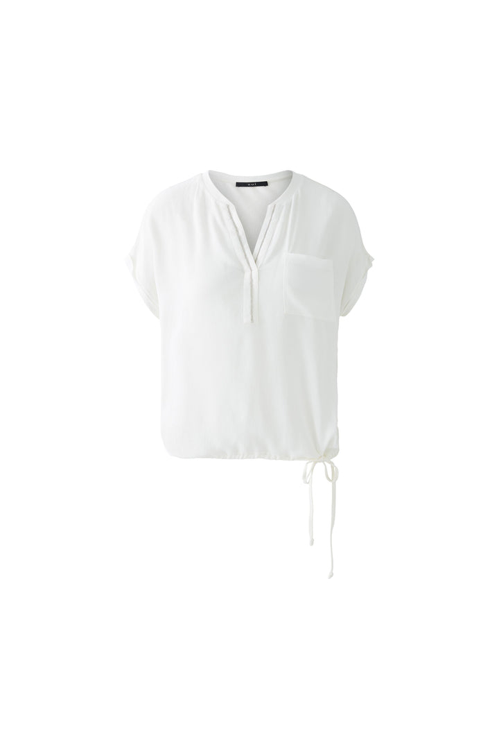 Blouse fluide à col V avec détail perlé