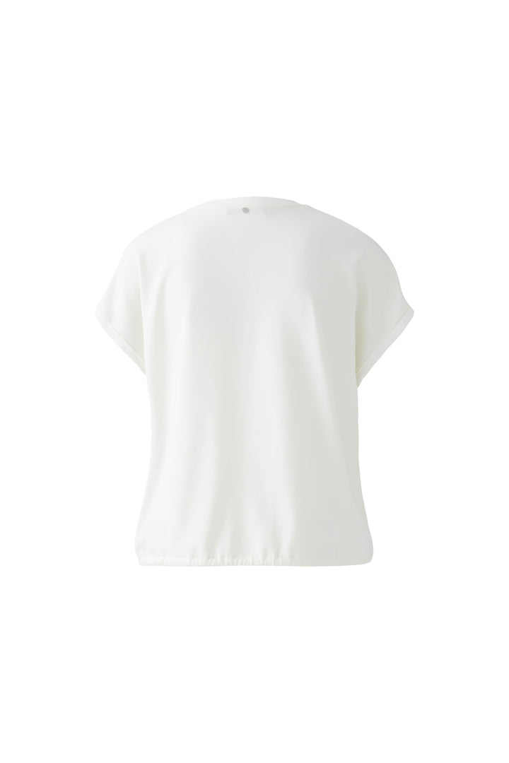 Blouse fluide à col V avec détail perlé