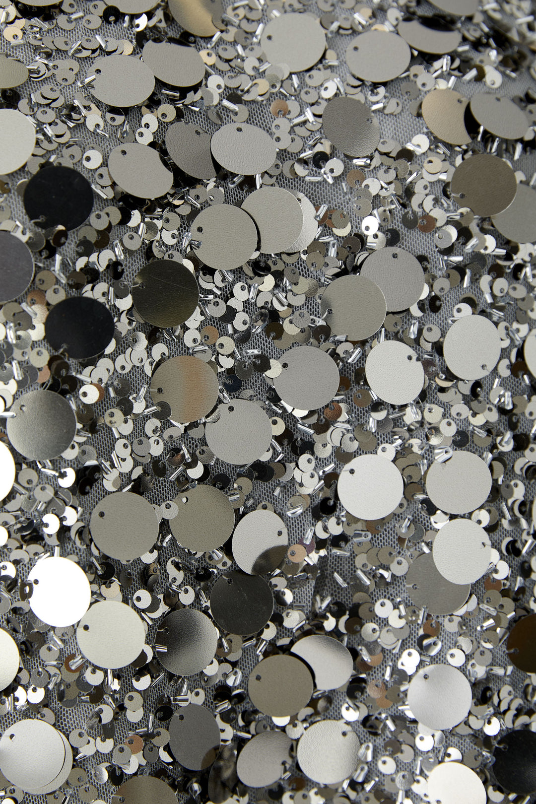 Haut sans manche argenté à pastilles et paillettes