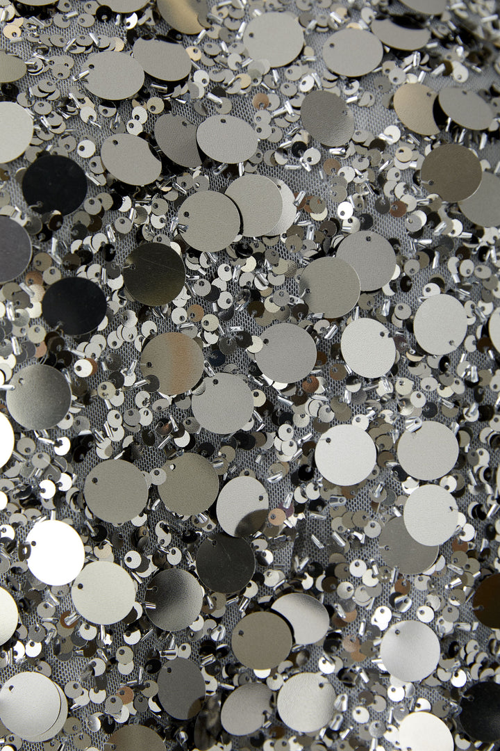 Haut sans manche argenté à pastilles et paillettes