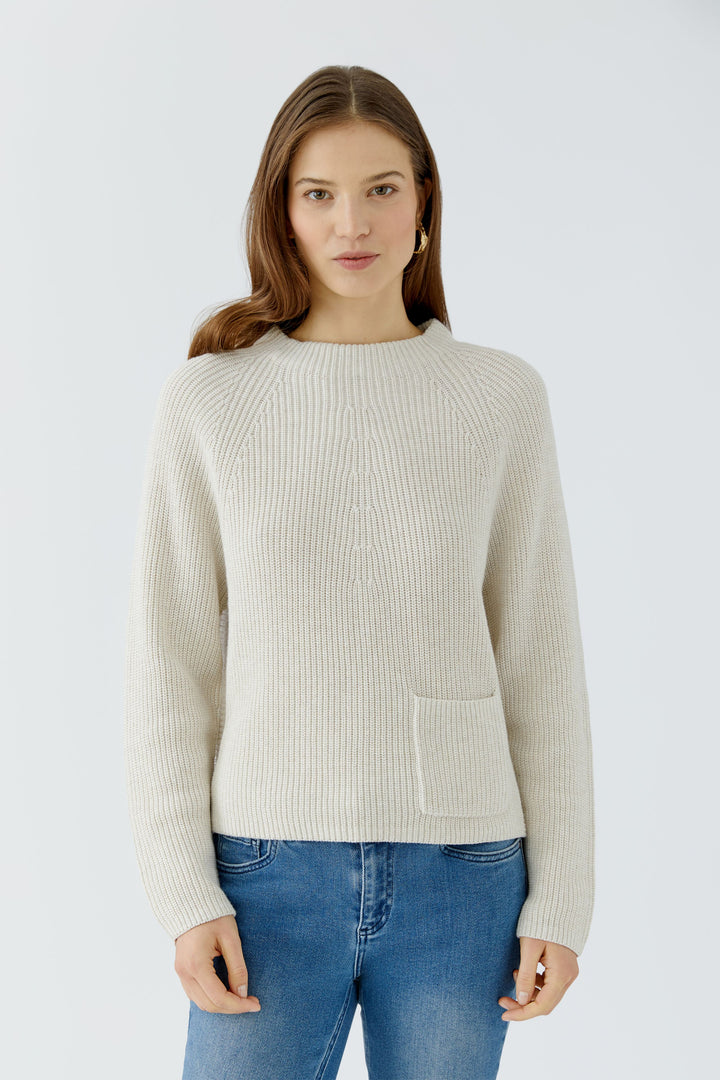 Pull texturé à poche plaquée