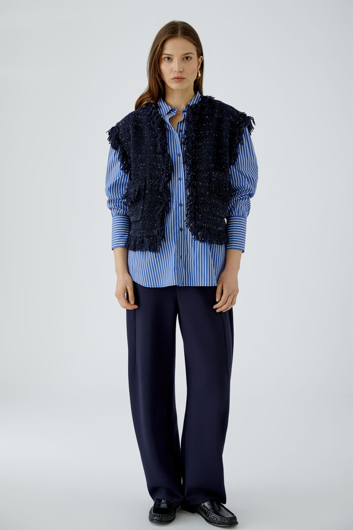 Gilet court en tweed bouclé à franges
