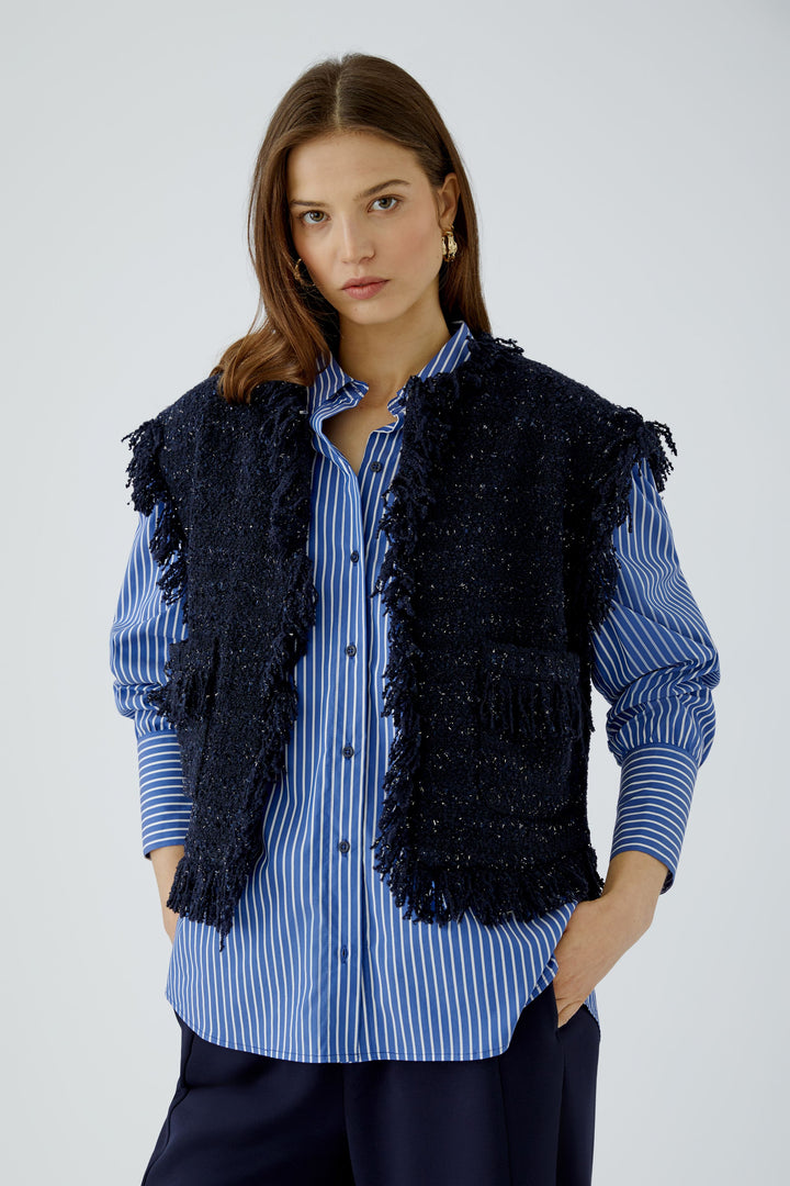 Gilet court en tweed bouclé à franges