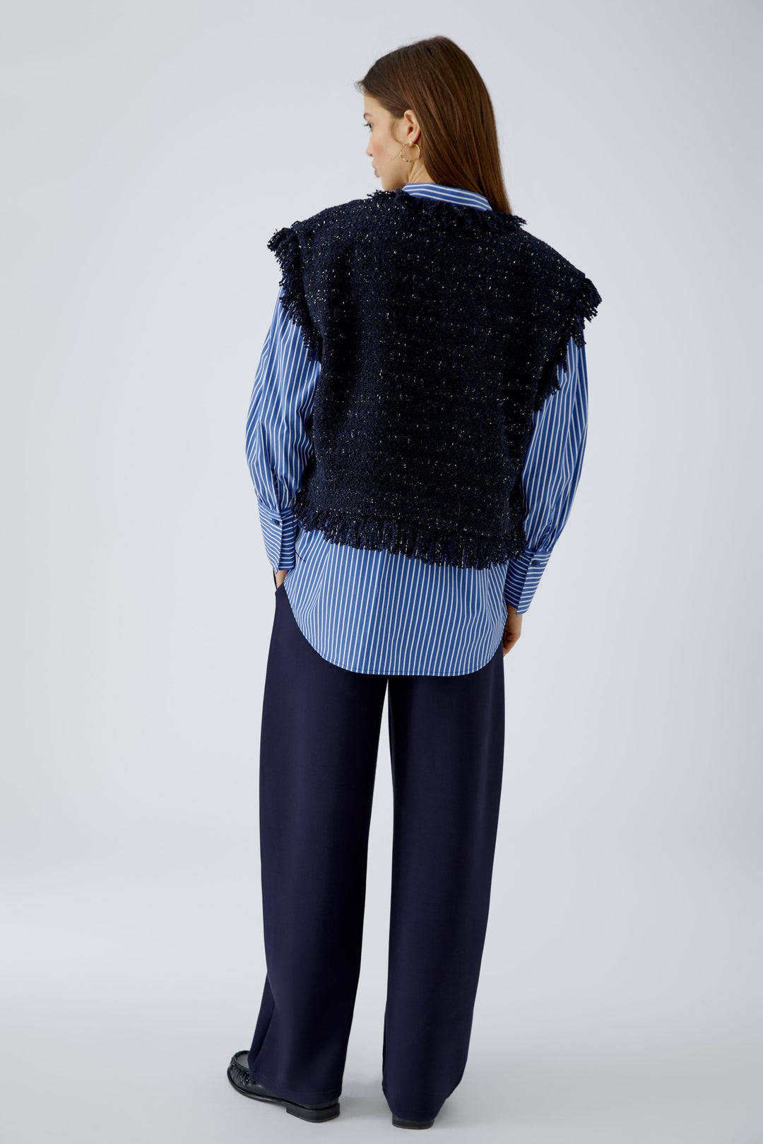 Gilet court en tweed bouclé à franges