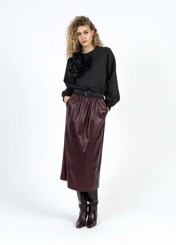 Haut manches longues avec fleur surdimensionnée