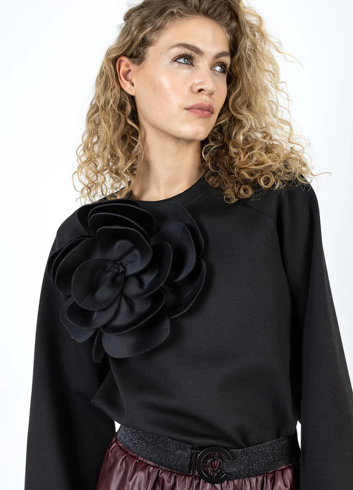 Haut manches longues avec fleur surdimensionnée