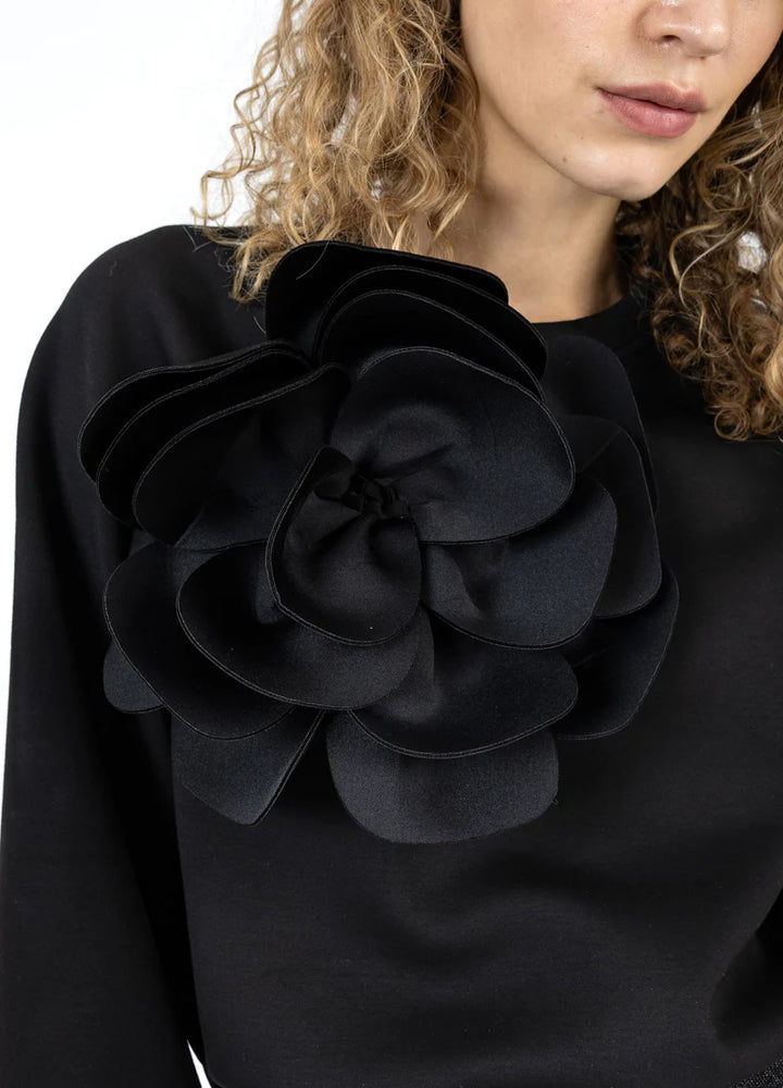 Haut manches longues avec fleur surdimensionnée