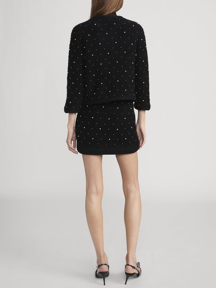 Veste courte en laine bouclée avec perles