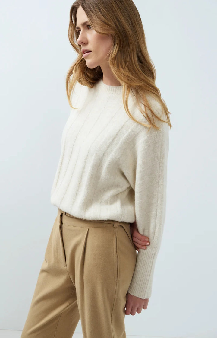 Pull ample à ourlet ajustable