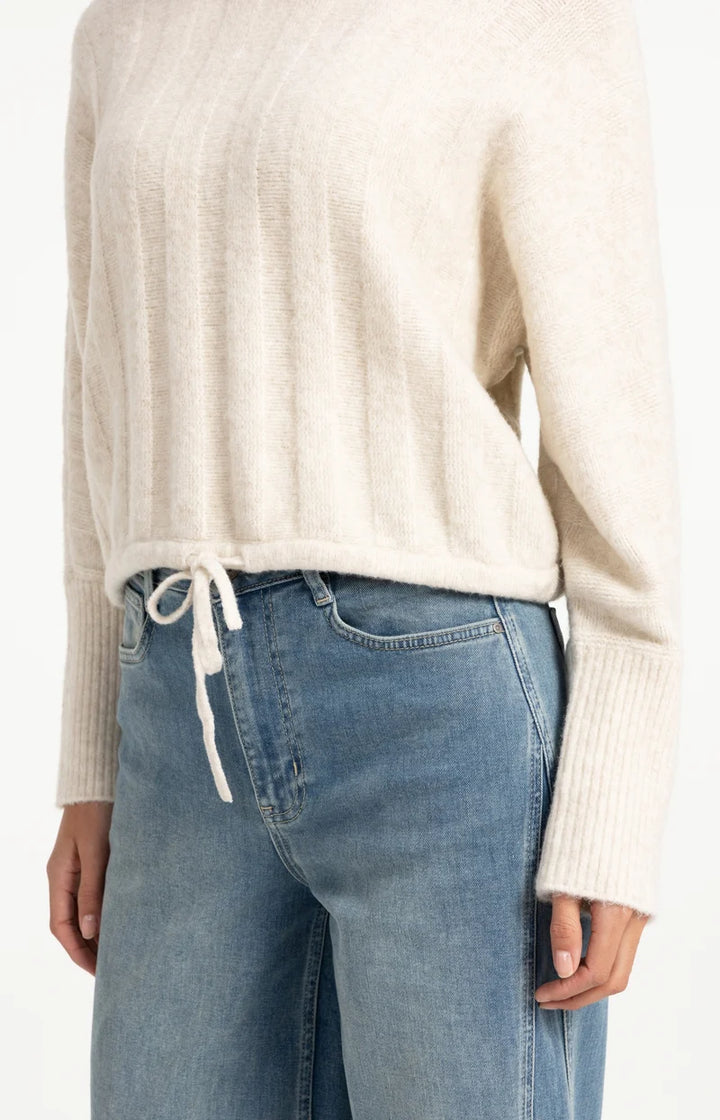 Pull ample à ourlet ajustable